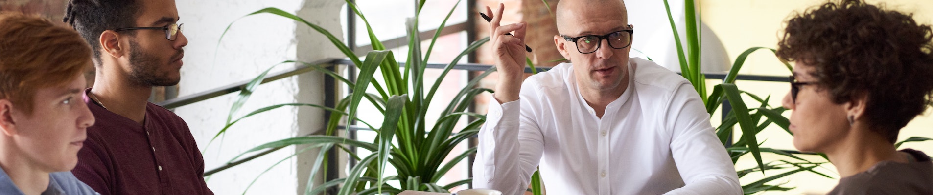 man wearing white long sleeved shirt holding black pen 3182781